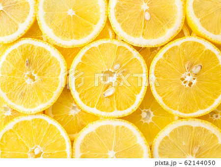 Abstract background of lemon slices top view. Abstract background of lemon slices top view. 62144050