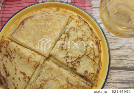 Traditional Russian food, delicious pancakes on a plate, stacked stack. The carnival and seeing the Russian winter, view from above Traditional Russian food, delicious pancakes on a plate, stacked stack. The carnival and seeing the Russian winter, view from above 62144936