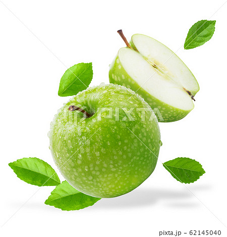 Water splashing on Fresh green apple on Green 62145040