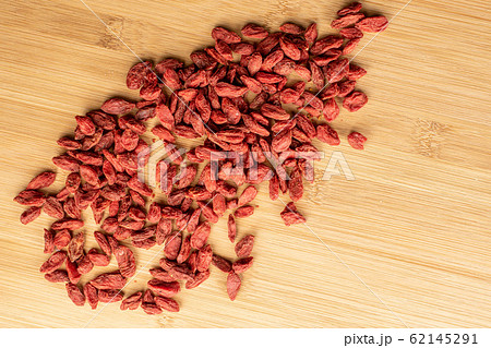 Red dried goji on light wood Red dried goji on light wood 62145291