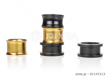 Stylish ear plug isolated on white 62145313