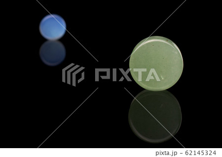 Stylish ear plug isolated on black glass 62145324