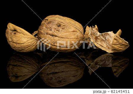Brown tasty walnut isolated on black glass 62145451