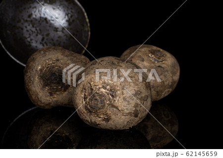 Raw sweet beetroot isolated on black glass Raw sweet beetroot isolated on black glass 62145659