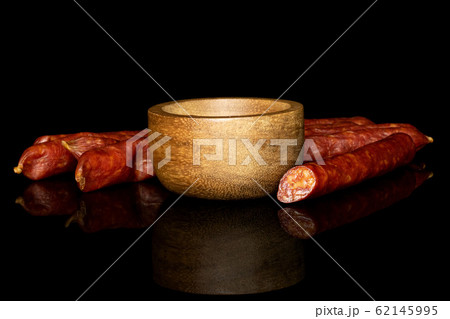Smoked spicy sausage isolated on black glass Smoked spicy sausage isolated on black glass 62145995