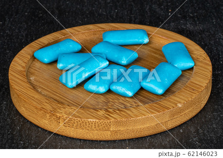 Blue chewing gum on grey stone 62146023
