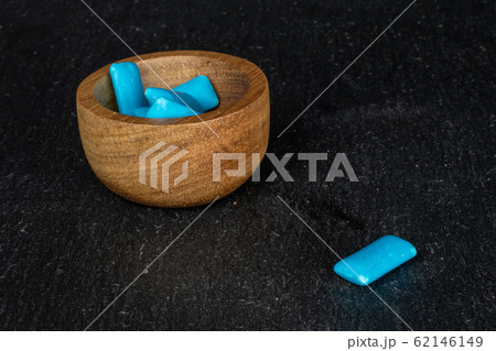 Blue chewing gum on grey stone Blue chewing gum on grey stone 62146149