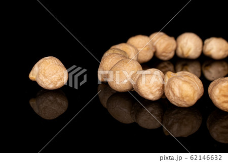 Fresh tan chickpea isolated on black glass 62146632
