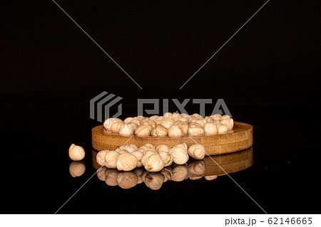 Fresh tan chickpea isolated on black glass 62146665