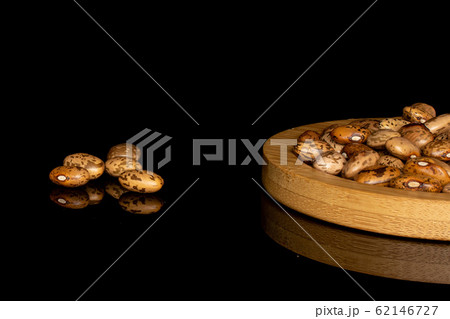 Pinto brown bean isolated on black glass 62146727