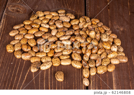 Pinto brown bean on brown wood Pinto brown bean on brown wood 62146808