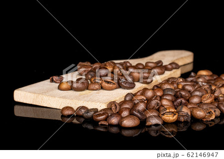 Fresh coffee bean isolated on black glass Fresh coffee bean isolated on black glass 62146947