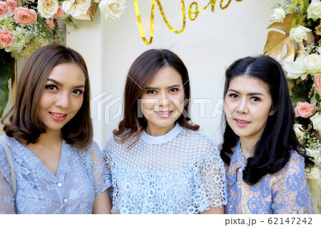 Three female friends look camera party outdoors 62147242