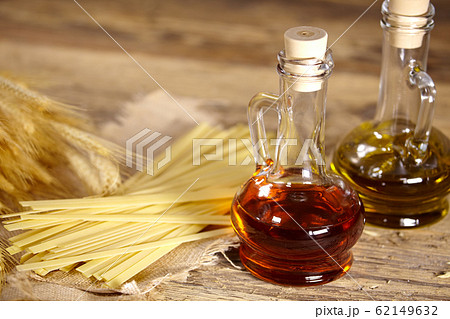 Bundle of uncooked dried Italian spaghetti  on old 62149632