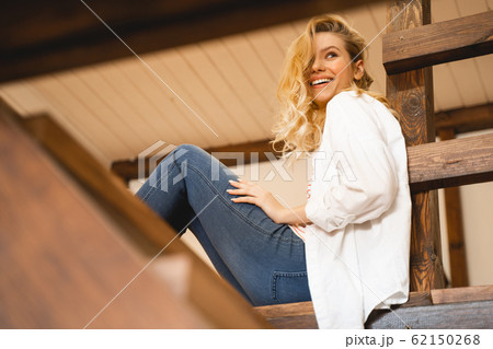Delighted female person demonstrating her sincere smile 62150268