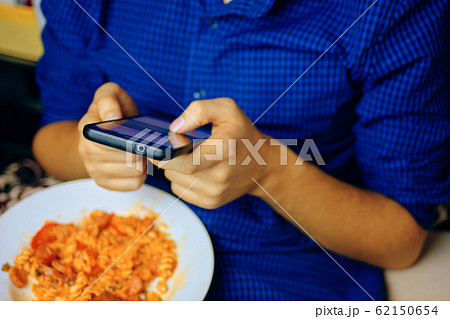 Using smartphone. 62150654