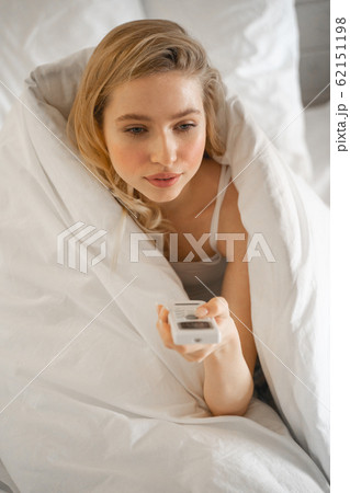 Portrait of cute girl that sitting in her bed Portrait of cute girl that sitting in her bed 62151198