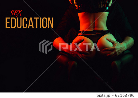 Sex education. Man holds his hands over the sexy ass of a girl Sex education. Man holds his hands over the sexy ass of a girl 62163796