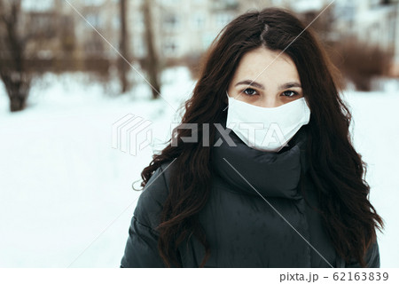 portrait of a white girl in a medical mask during an epidemic portrait of a white girl in a medical mask during an epidemic 62163839