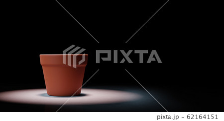 Single Empty Flowerpot Spotlighted on Black Background 62164151