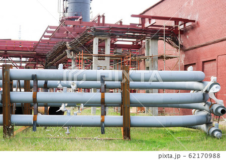 A large iron metal piping trestle with pipes A large iron metal piping trestle with pipes 62170988