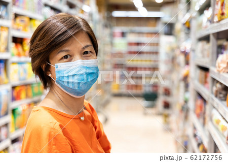 Asian women with face mask for protection against influenza virus Asian women with face mask for protection against influenza virus 62172756