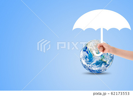 Hand holding white umbrella to protect blue planet earth. 62173553