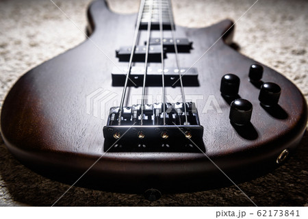 Bass electric guitar with four strings closeup. Bass electric guitar with four strings closeup. 62173841