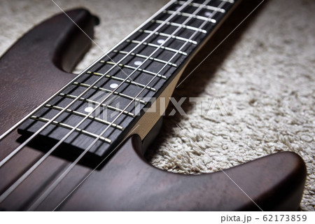 Bass guitar with four strings closeup. Detail of Bass guitar with four strings closeup. Detail of 62173859