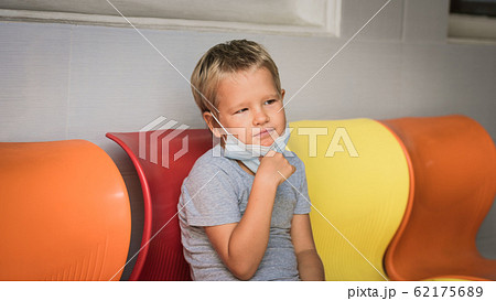 Boy wearing facial disposable mask. Virus Boy wearing facial disposable mask. Virus 62175689