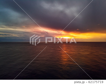 Bright colourful sunset over sea Bright colourful sunset over sea 62175719