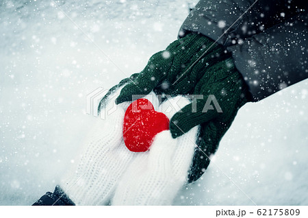 homosexual couple holding heart on valentines day. 62175809