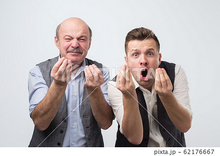 Mature hispanic man pointing with finger while arguing with his opponent. He is not agree with arguments. Mature hispanic man pointing with finger while arguing with his opponent. He is not agree with arguments. 62176667