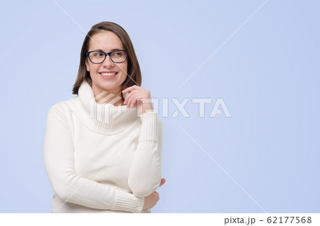 Beautiful mature happy woman smiling confidently looking aside on copyspace. Beautiful mature happy woman smiling confidently looking aside on copyspace. 62177568