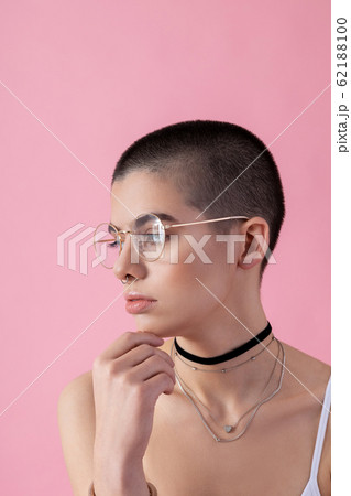 Pretty lady wearing jewelry and glasses stock photo 62188100