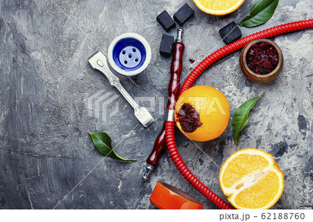 Hookah with orange tobacco. 62188760