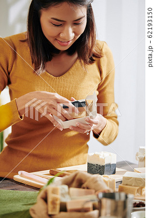 Woman packing soap bars Woman packing soap bars 62193150