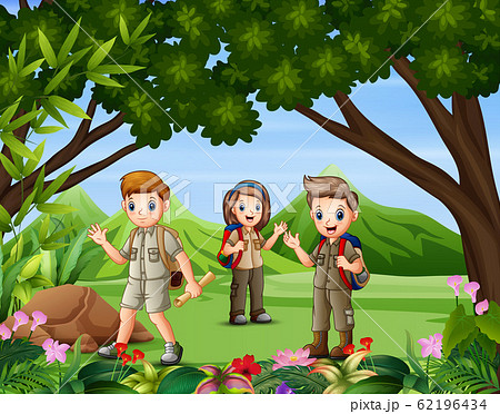 A group of scouts hiking in the forest A group of scouts hiking in the forest 62196434