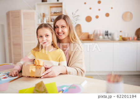 Happy Mother and Daughter Posing Together 62201194