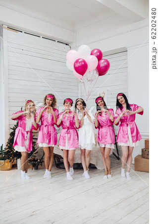 Bridesmaids and bride having fun at bachelorette Bridesmaids and bride having fun at bachelorette 62202480