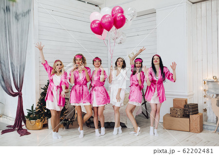 Bridesmaids and bride having fun at bachelorette Bridesmaids and bride having fun at bachelorette 62202481
