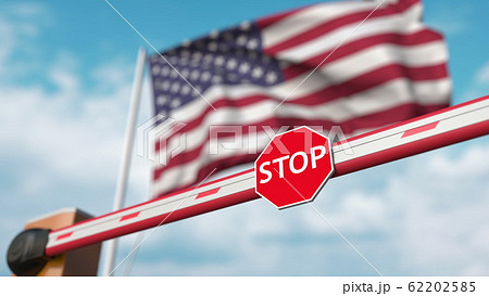 Closed boom barrier with stop sign against the American flag. Restricted entry or certain ban in the USA. 3D rendering 62202585