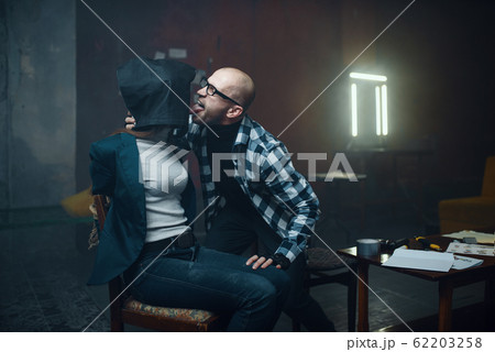 Maniac kidnapper licks his female victim Maniac kidnapper licks his female victim 62203258