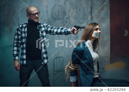 Maniac kidnapper puts a gun to his victim's head Maniac kidnapper puts a gun to his victim's head 62203266