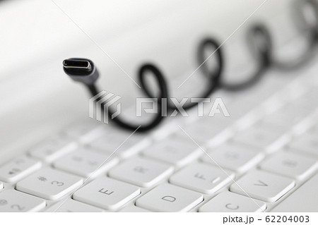 Focus on usb wire and at background keyboard. 62204003