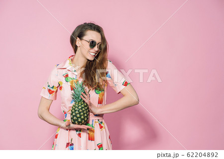 Pineapple in lady's hands. Trendy and stylish fashion. Pineapple in lady's hands. Trendy and stylish fashion. 62204892