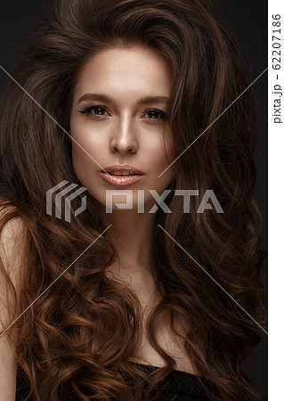 Beautiful brunette model : volume curls, classic makeup and sexy lips. The beauty face. Beautiful brunette model : volume curls, classic makeup and sexy lips. The beauty face. 62207186