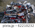charred charcoal. dying bonfire in the ashes 62210232