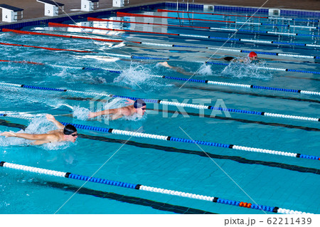 Swimmers swimming in the pool Swimmers swimming in the pool 62211439