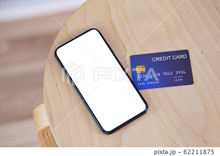 Credit card and Smartphone Blank screen with clipping path on wood table 62211875